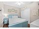 Cozy bedroom with a full-size bed, nautical accents, and ample storage with side tables at 3401 N Ocean Blvd. # 309, North Myrtle Beach, SC 29582
