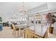 Bright dining area next to a comfortable living room, with large windows providing ample natural light at 3401 N Ocean Blvd. # 309, North Myrtle Beach, SC 29582