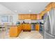 Spacious kitchen with stainless steel appliances, granite countertops, and an adjacent dining area at 3401 N Ocean Blvd. # 309, North Myrtle Beach, SC 29582