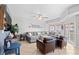 Spacious living room with tan tile flooring, comfortable seating, and views of the balcony at 3401 N Ocean Blvd. # 309, North Myrtle Beach, SC 29582