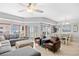 Open floor plan with living, dining areas with tile flooring, large windows, and balcony access at 3401 N Ocean Blvd. # 309, North Myrtle Beach, SC 29582