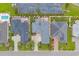 Aerial view of homes with landscaped yards, pools, driveways, and lush green surroundings in this neighborhood at 372 Waterfall Circle, Little River, SC 29566