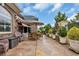 Beautiful backyard patio with nice outdoor seating, green plants and an elegant brick and stone border wall at 372 Waterfall Circle, Little River, SC 29566
