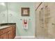 Well-lit bathroom features a shower with glass doors at 372 Waterfall Circle, Little River, SC 29566