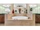 Bright bathroom featuring a large soaking tub at 372 Waterfall Circle, Little River, SC 29566