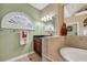 Well-lit bathroom with large tub and decorative accents at 372 Waterfall Circle, Little River, SC 29566