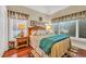 Bedroom with large windows, hardwood floors, and neutral decor at 372 Waterfall Circle, Little River, SC 29566