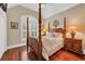 Bedroom with wood floors, four poster bed, and window with blinds at 372 Waterfall Circle, Little River, SC 29566