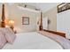 Bedroom featuring a four-poster bed, vaulted ceiling, and neutral decor at 372 Waterfall Circle, Little River, SC 29566