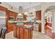 Well-appointed kitchen with custom cabinets, granite counters, stainless steel appliances, and an island at 372 Waterfall Circle, Little River, SC 29566