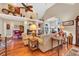 Spacious living room with hardwood floors, a cozy fireplace, and plenty of natural light at 372 Waterfall Circle, Little River, SC 29566