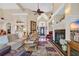 Elegant living room features a fireplace, high ceilings, and an open layout leading to the entryway at 372 Waterfall Circle, Little River, SC 29566