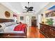 Spacious main bedroom features hardwood floors, ceiling fan and lots of light at 372 Waterfall Circle, Little River, SC 29566