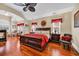 Spacious main bedroom with hardwood floors, a fireplace, and large windows for natural light at 372 Waterfall Circle, Little River, SC 29566