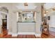 View of a pass through that has a black granite countertop and access to the kitchen area at 372 Waterfall Circle, Little River, SC 29566