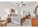 Bedroom boasting ceiling fan, closet, and bed with accent pillows and side tables at 3802 Seedling Ct., North Myrtle Beach, SC 29582