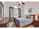 Bedroom featuring a window with plaid curtains, dresser and bed with accent pillows at 3802 Seedling Ct., North Myrtle Beach, SC 29582