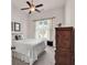 Bright bedroom with a ceiling fan, a large window, and a bed with white bedding at 3802 Seedling Ct., North Myrtle Beach, SC 29582