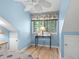 Bedroom with a table below a window and white doors on either side at 400 Melrose Pl. # 14E, Myrtle Beach, SC 29572