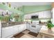 Clean kitchen with white cabinetry, granite countertops, and stainless steel appliances at 400 Melrose Pl. # 14E, Myrtle Beach, SC 29572