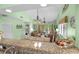 Open-concept living area with comfortable seating, a dining area, and a view from the granite countertop at 400 Melrose Pl. # 14E, Myrtle Beach, SC 29572