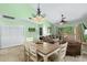 Inviting living area with a dining table, comfortable seating, and a sliding door to the outdoor deck at 400 Melrose Pl. # 14E, Myrtle Beach, SC 29572