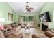 Comfortable living room with vaulted ceilings and outdoor deck access at 400 Melrose Pl. # 14E, Myrtle Beach, SC 29572