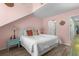 Bright bedroom with vaulted ceilings, a white wicker headboard, and coastal décor at 400 Melrose Pl. # 14E, Myrtle Beach, SC 29572