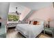 Charming main bedroom with a large window, vaulted ceiling, and coastal decor at 400 Melrose Pl. # 14E, Myrtle Beach, SC 29572
