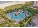 Fun water park with slides and play structures, surrounded by lush greenery and lounge chairs at 400 Melrose Pl. # 14E, Myrtle Beach, SC 29572