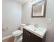 Well-lit bathroom featuring a modern vanity, toilet, and neutral wall color at 401 Alder St., Myrtle Beach, SC 29577