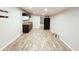 Spacious living room with a kitchenette, refrigerator, and laminate floors at 401 Alder St., Myrtle Beach, SC 29577