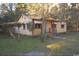 Charming single-story house with a covered porch and small front yard needing TLC at 414 E Wine St., Mullins, SC 29574