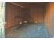 Inside a wooden storage shed, showing exposed framework and a concrete floor at 414 E Wine St., Mullins, SC 29574