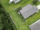 Birds eye view of a backyard featuring a small patio with furniture and mature trees for privacy at 424 Enderby Way, Little River, SC 29566