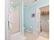 Cozy bathroom featuring a tiled shower, toilet, and access to a walk-in closet at 424 Enderby Way, Little River, SC 29566