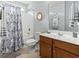 Full bathroom featuring a shower and bathtub, and a vanity with storage space at 424 Enderby Way, Little River, SC 29566
