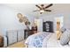 Bright bedroom with ceiling fan, carpet, and stylish decor with access to the bathroom and closet at 424 Enderby Way, Little River, SC 29566