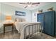 Charming bedroom featuring a full-sized bed, ceiling fan, and decorative furniture at 424 Enderby Way, Little River, SC 29566