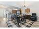 Open concept dining and kitchen features bar top and plenty of room for entertaining guests at 424 Enderby Way, Little River, SC 29566