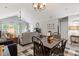 Spacious living room with vaulted ceilings, neutral tones, and comfortable seating arrangement at 424 Enderby Way, Little River, SC 29566