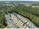 Aerial view of a neighborhood showcasing well-maintained homes, lush greenery, and community layout at 439 Colonial Trace Dr. # 119, Longs, SC 29568