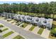 Beautiful townhomes boast manicured lawns, covered parking, and easy access to the golf course and landscaping at 439 Colonial Trace Dr. # 119, Longs, SC 29568