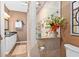 Elegant bathroom featuring decorative tile shower with glass door, granite counter and vanity with ample storage space at 439 Colonial Trace Dr. # 119, Longs, SC 29568