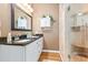 Elegant bathroom showcasing double sinks, granite countertops, and a glass-enclosed shower with a built-in seat at 439 Colonial Trace Dr. # 119, Longs, SC 29568