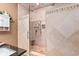 Luxurious shower featuring multiple showerheads, decorative tile, and a built-in seat for a spa-like experience at 439 Colonial Trace Dr. # 119, Longs, SC 29568