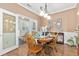Charming dining room with hardwood floors and access to the sunroom at 439 Colonial Trace Dr. # 119, Longs, SC 29568
