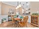 Inviting dining room featuring hardwood floors and stylish decor adjacent to kitchen at 439 Colonial Trace Dr. # 119, Longs, SC 29568