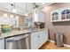 Open kitchen featuring granite countertops, stainless steel appliances, and white cabinetry at 439 Colonial Trace Dr. # 119, Longs, SC 29568