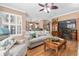 Cozy living room with a brick fireplace, dark wood floors, and neutral-colored furnishings at 439 Colonial Trace Dr. # 119, Longs, SC 29568